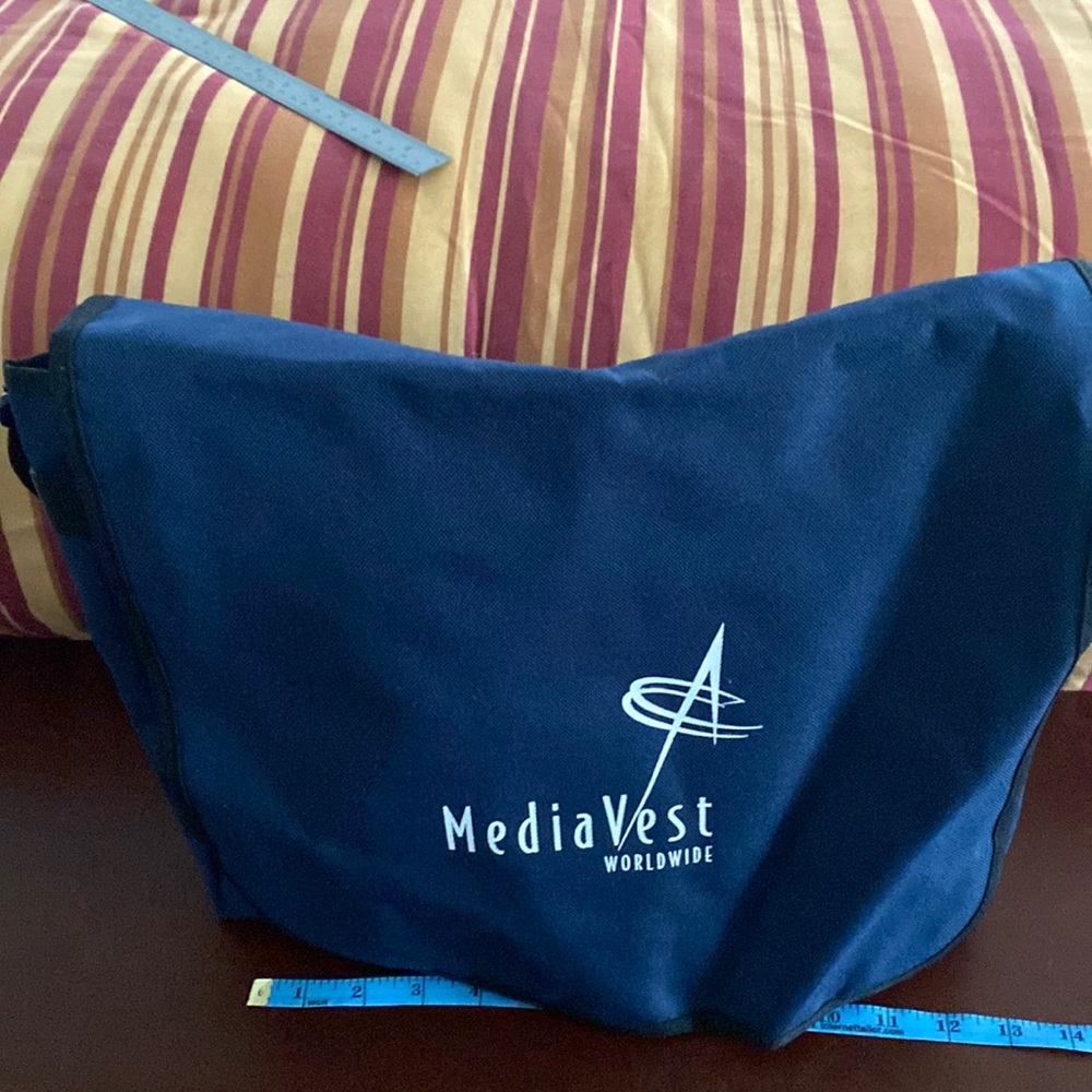NWOT blue promotional shoulder bag with a zippered section.Can use as laptop bag